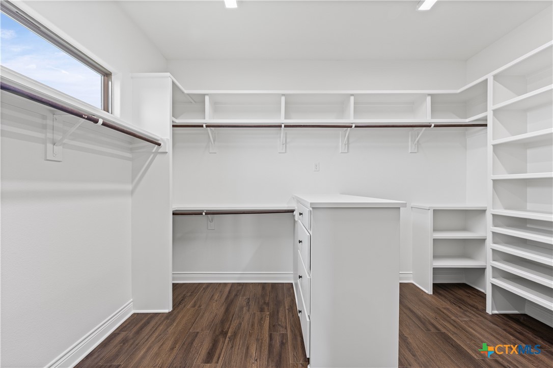 11023 Bigham Road Troy, TX 76579 - Photo 21 of 42 a view of walk in closet with empty racks