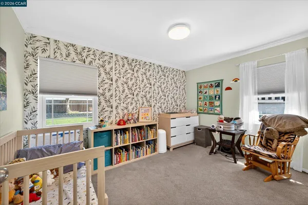 a room with furniture toys and a book shelf