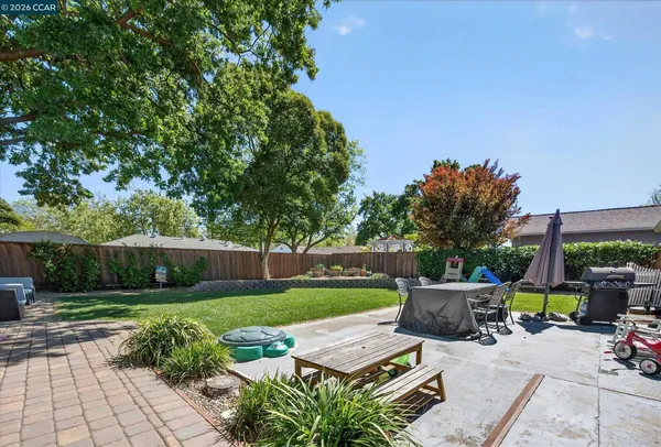 a view of backyard with seating space