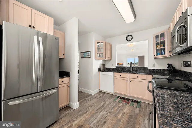 a bathroom with a sink a mirror and a shower