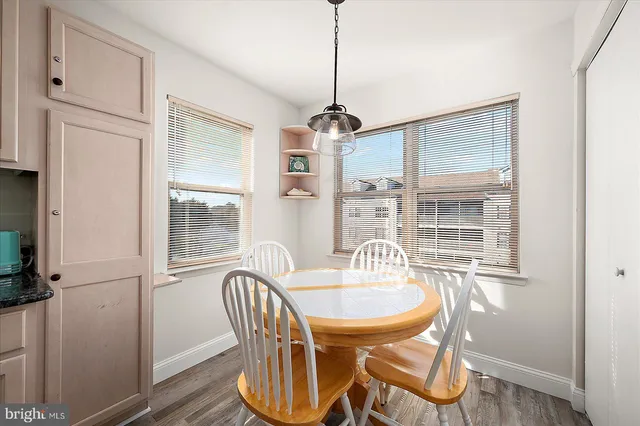 a view of a large building with a big yard and large trees