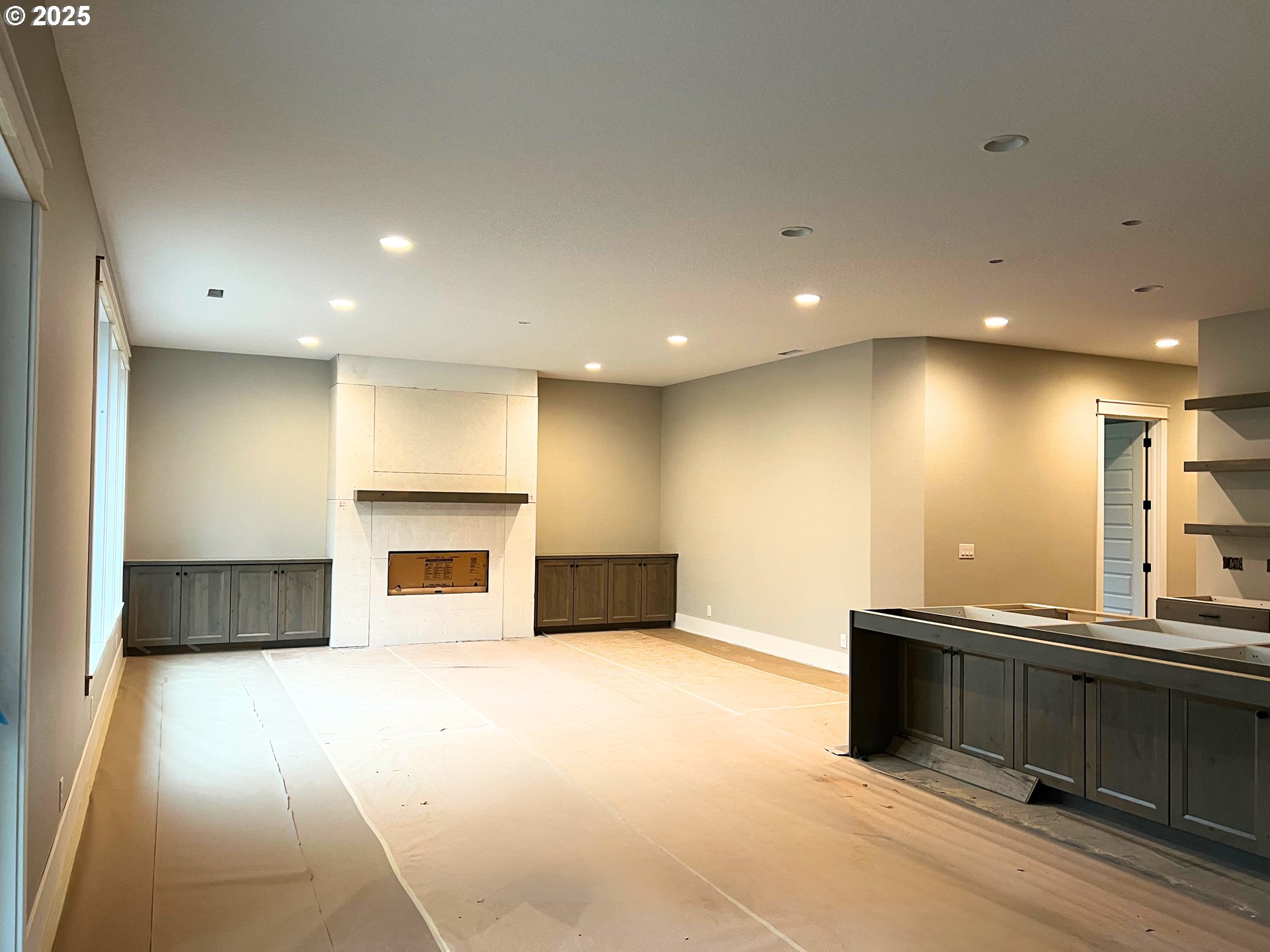 16221 Northeast 180th Street Brush Prairie, WA 98606 - Photo 11 of 43 a view of an empty room with a fireplace