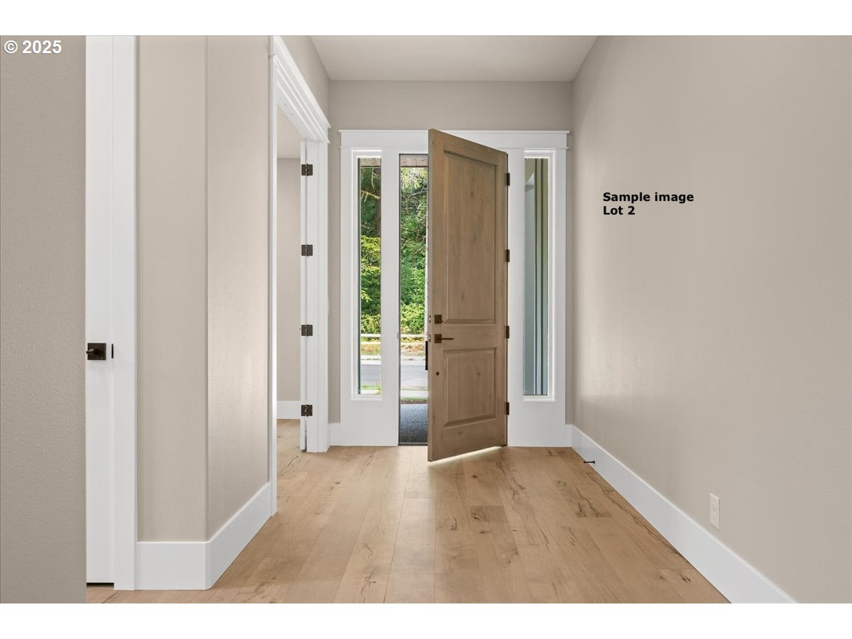 16221 Northeast 180th Street Brush Prairie, WA 98606 - Photo 14 of 43 a view of an empty room with wooden floor