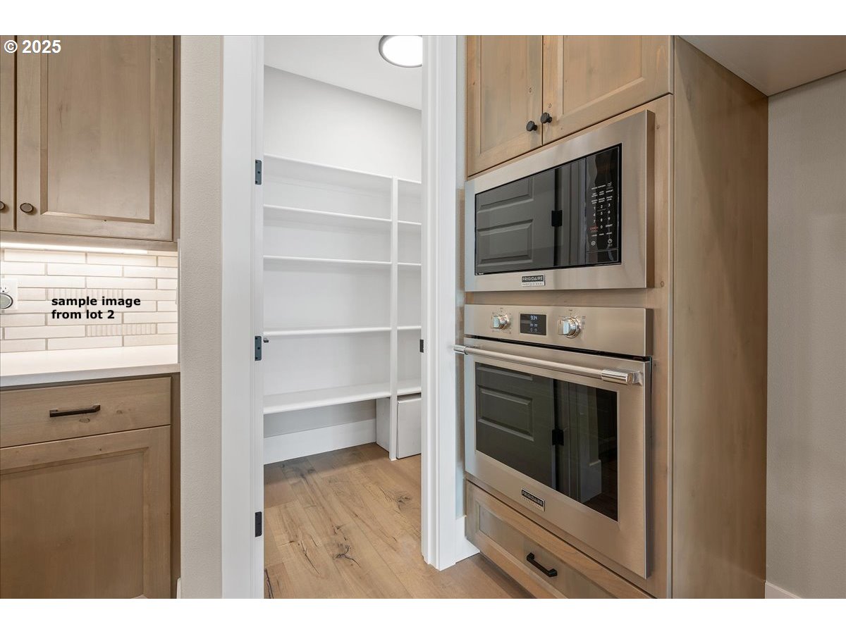 16221 Northeast 180th Street Brush Prairie, WA 98606 - Photo 17 of 43 a kitchen with a stove and a microwave