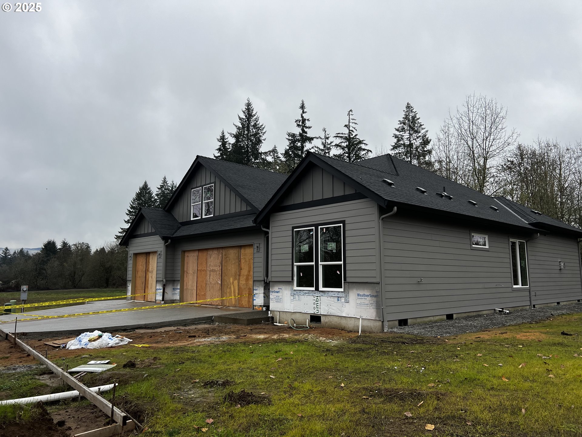 16221 Northeast 180th Street Brush Prairie, WA 98606 - Photo 3 of 43 a front view of a house with a yard