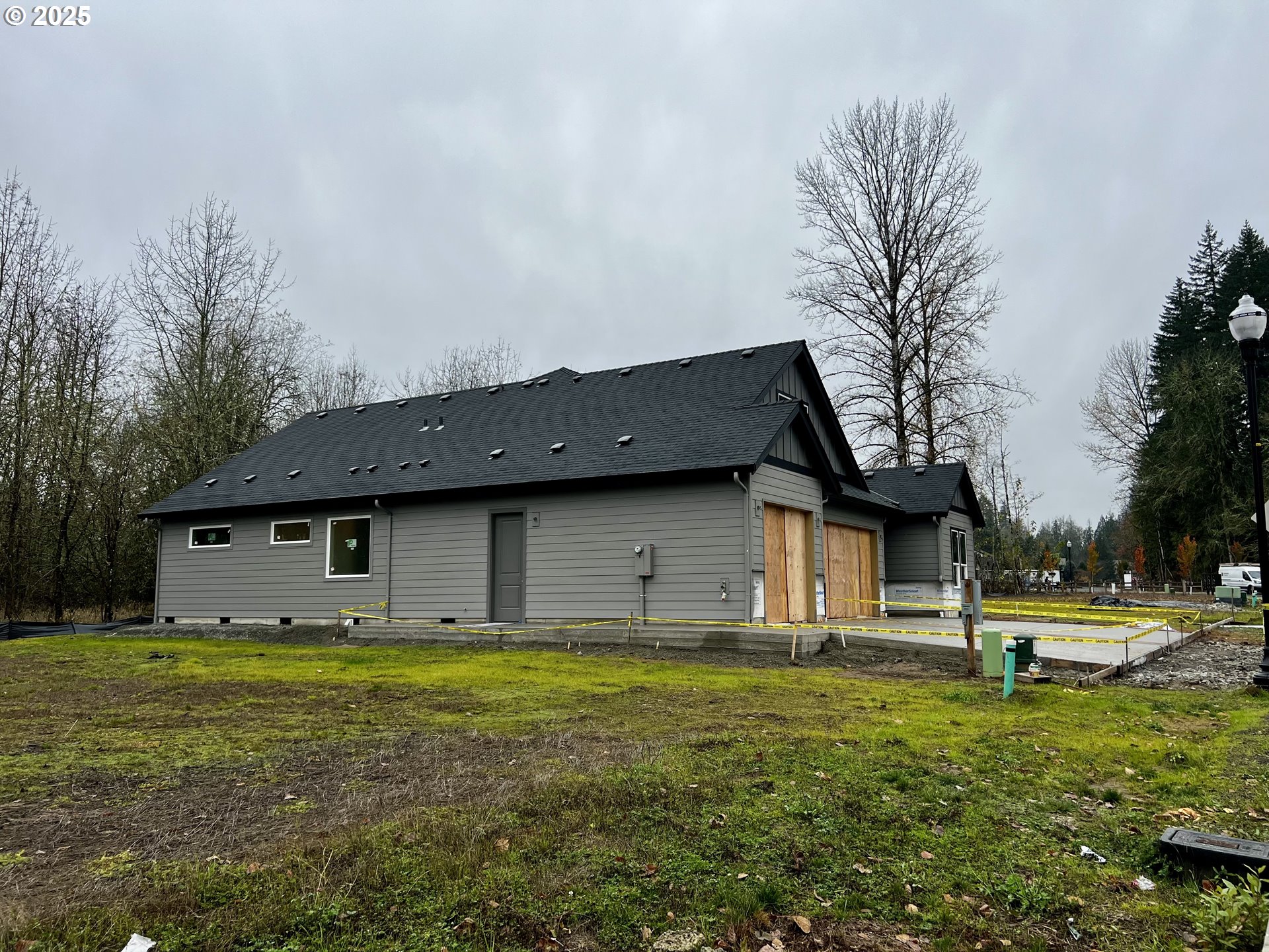 16221 Northeast 180th Street Brush Prairie, WA 98606 - Photo 4 of 43 a house with huge green field in front of it