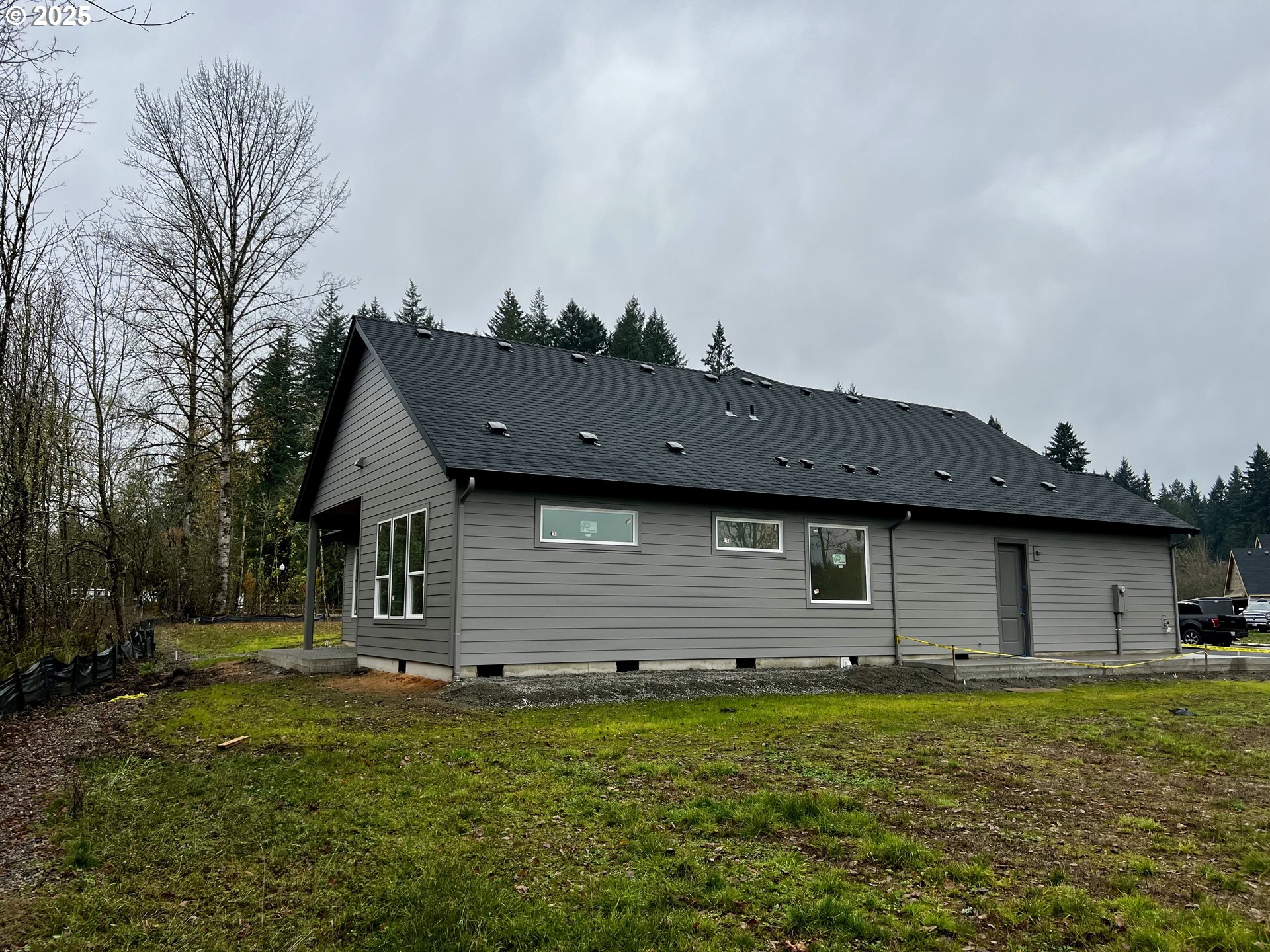 16221 Northeast 180th Street Brush Prairie, WA 98606 - Photo 5 of 43 a backyard of a house with lots of green space