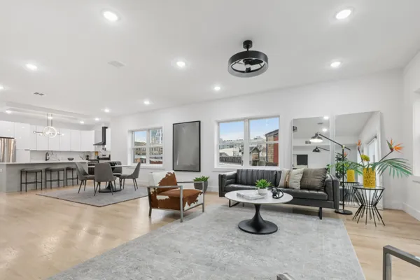 a living room with furniture and a table
