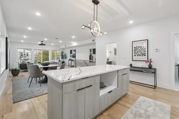 a large kitchen with stainless steel appliances lots of counter space