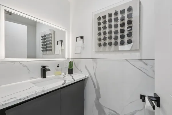 a bathroom with a sink and a mirror