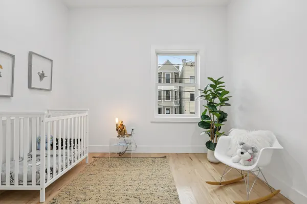 a bedroom with furniture and a window