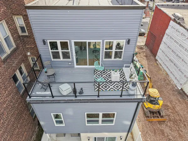 a front view of a house with chairs