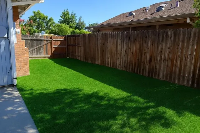 a backyard of a house with lots of green space
