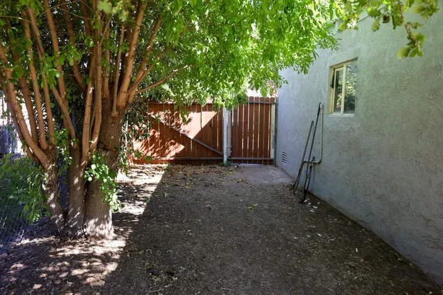 a view of yard with grass and a cabin