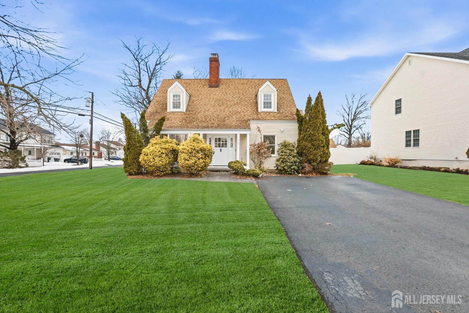 269 Remsen Avenue Avenel, NJ 07001 - Photo 1 of 1 a view of a white house with a big yard and large trees