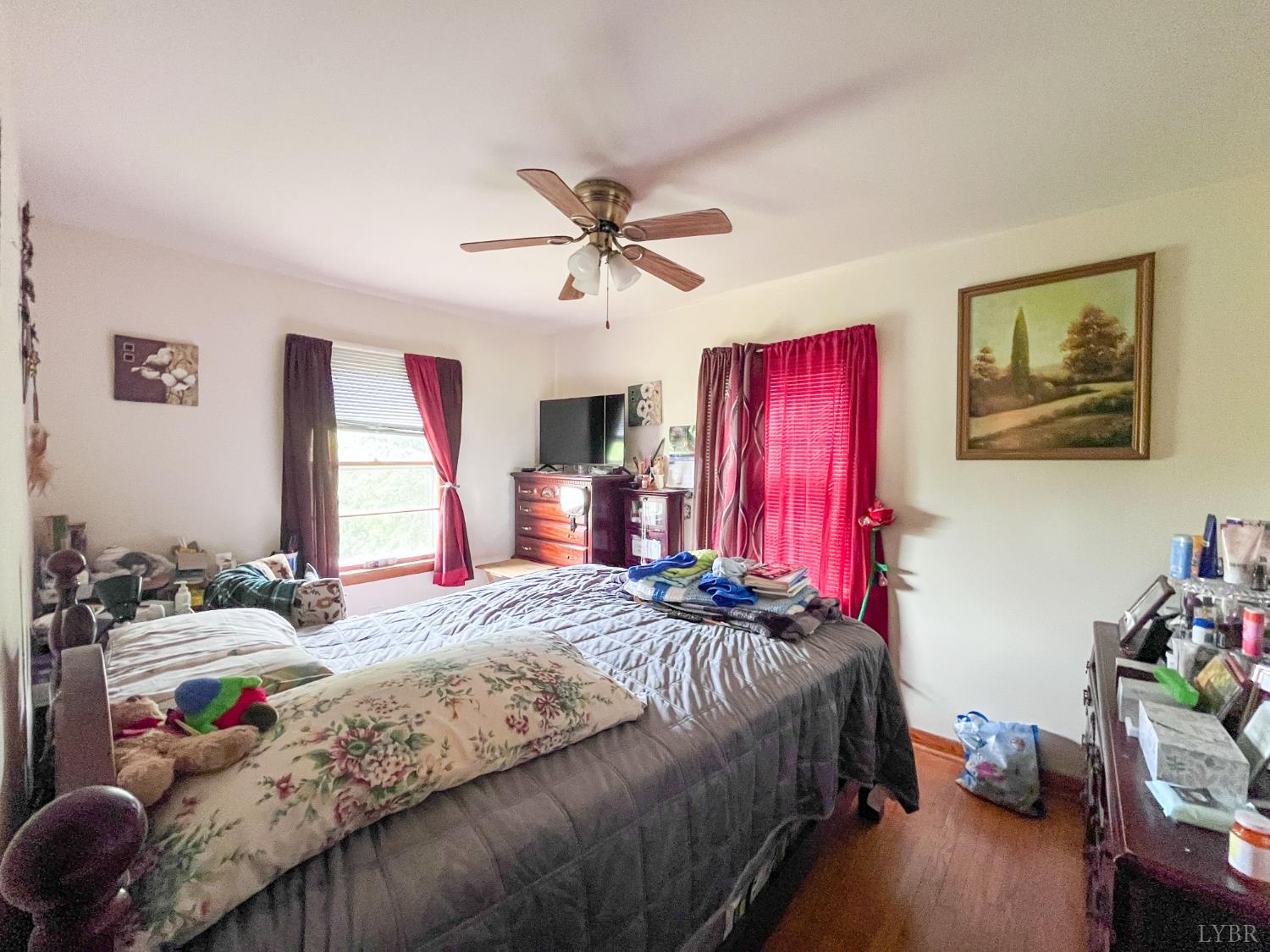 2663 Dearing Ford Road Altavista, VA 24517 - Photo 17 of 21 a bedroom with a bed and a chandelier
