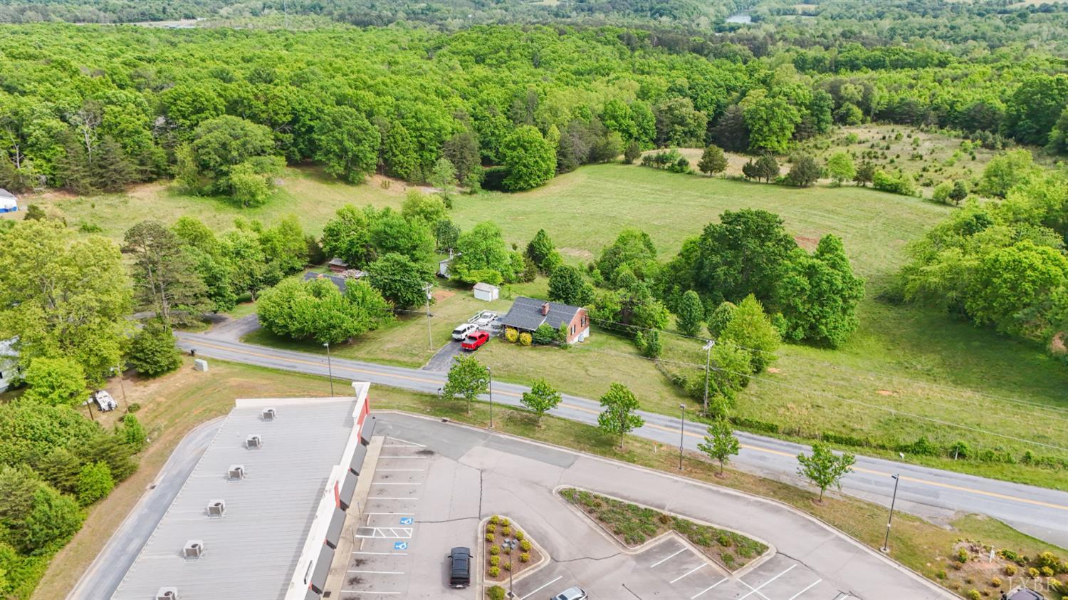 2663 Dearing Ford Road Altavista, VA 24517 - Photo 3 of 21 an aerial view of a house with a yard and lake view