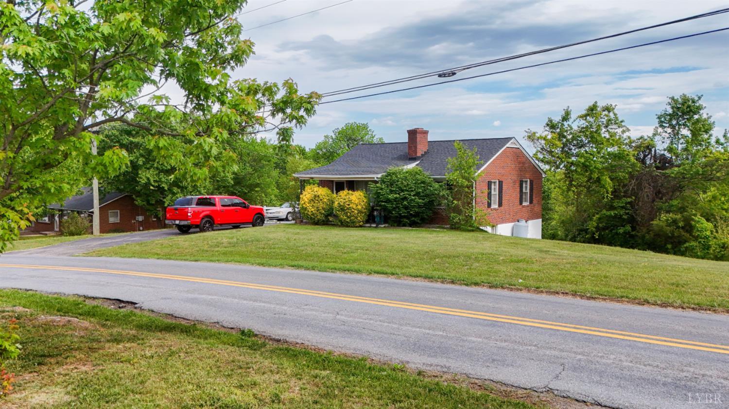 2663 Dearing Ford Road Altavista, VA 24517 - Photo 5 of 21 a front view of a house with a yard and garage