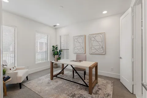 a living room with furniture and window