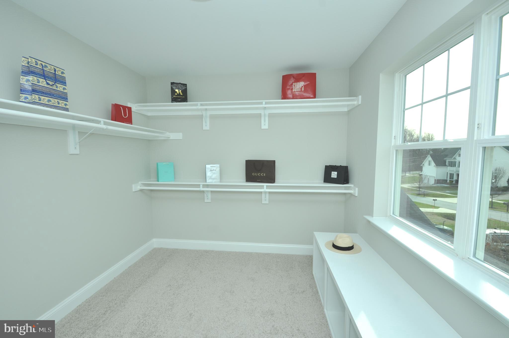 9138 Eton Road Silver Spring, MD 20901 - Photo 10 of 24 a view of storage and utility room with washer and dryer
