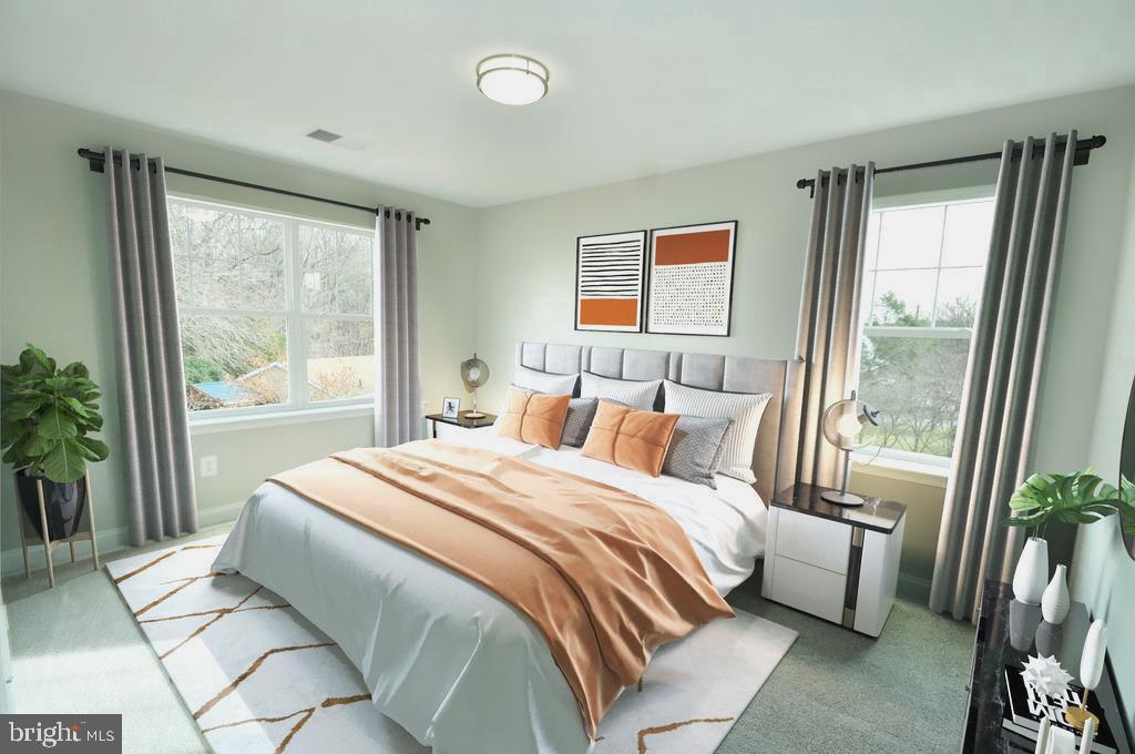 9138 Eton Road Silver Spring, MD 20901 - Photo 11 of 24 a bedroom with a bed and a large window