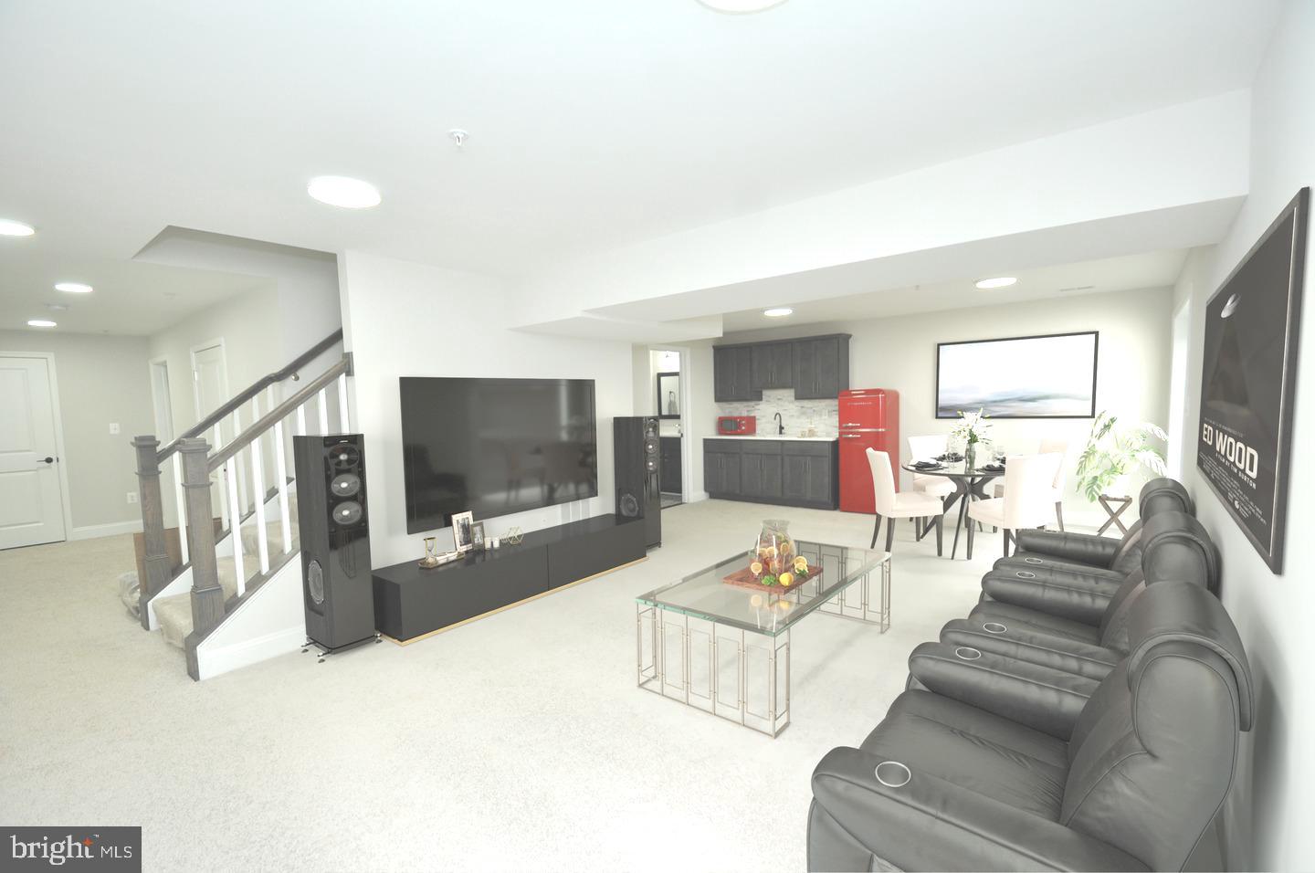 9138 Eton Road Silver Spring, MD 20901 - Photo 14 of 24 a living room with furniture and a flat screen tv