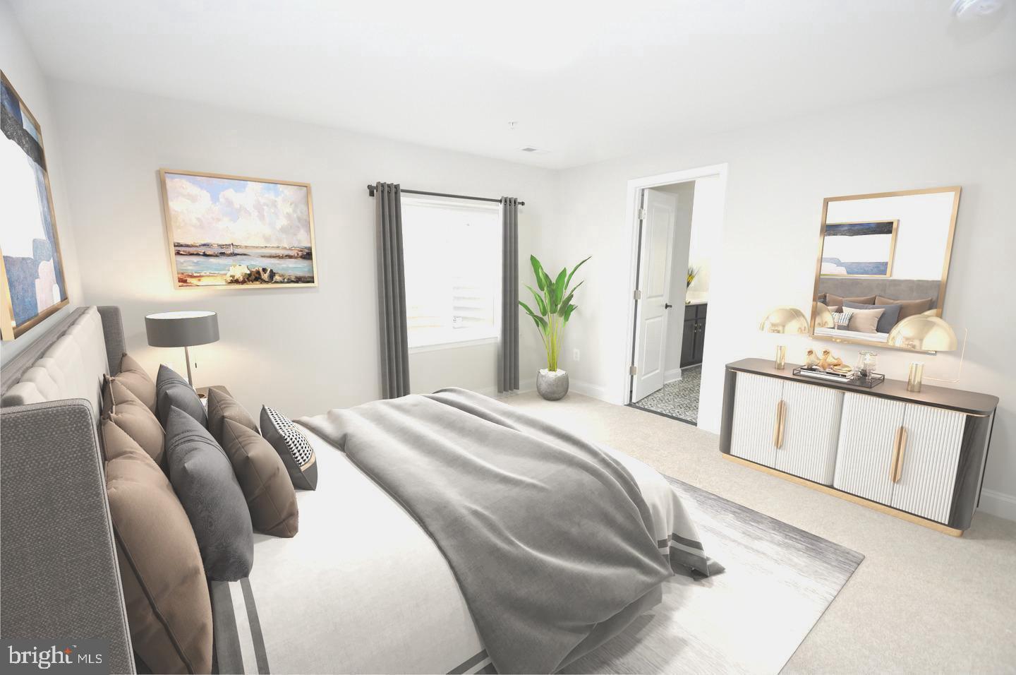 9138 Eton Road Silver Spring, MD 20901 - Photo 15 of 24 a bedroom with a bed a mirror and a large window