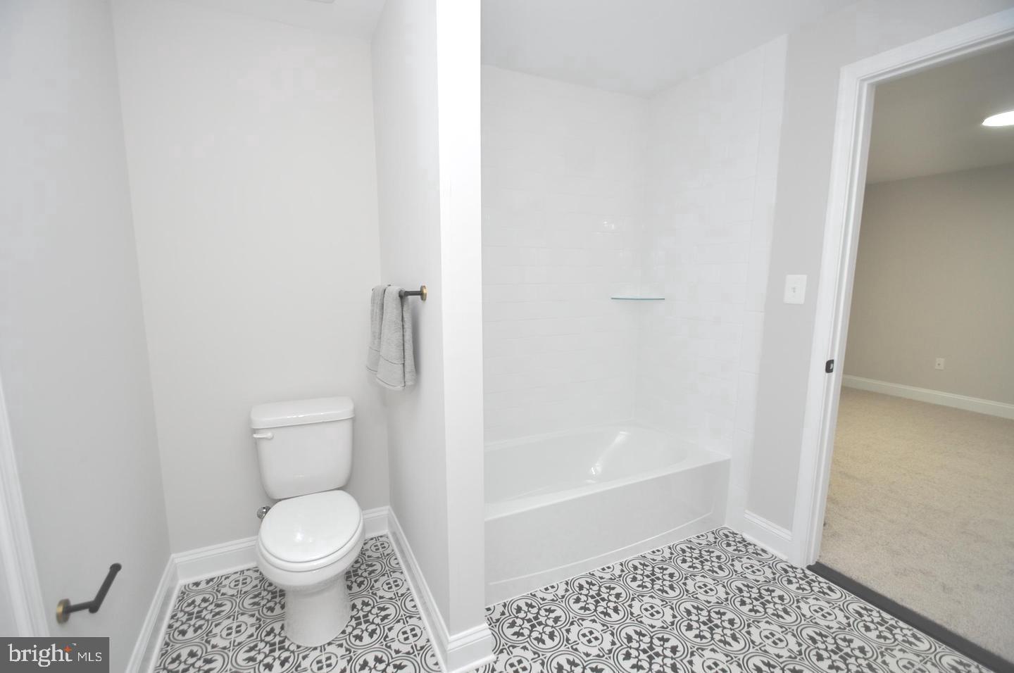9138 Eton Road Silver Spring, MD 20901 - Photo 17 of 24 a bathroom with a toilet and a shower