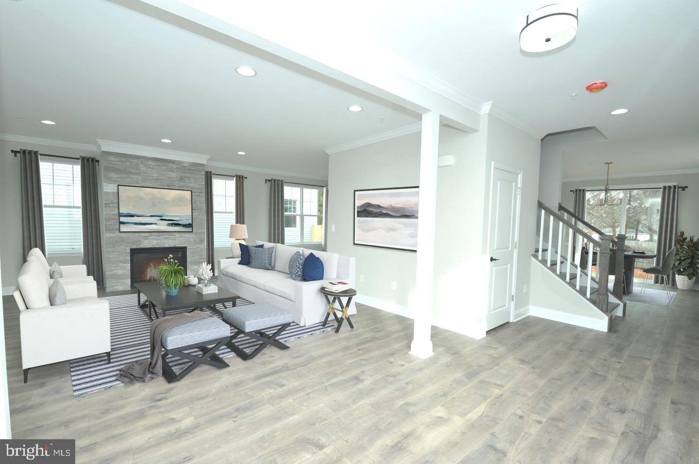 9138 Eton Road Silver Spring, MD 20901 - Photo 23 of 24 a living room with fireplace furniture and a wooden floor