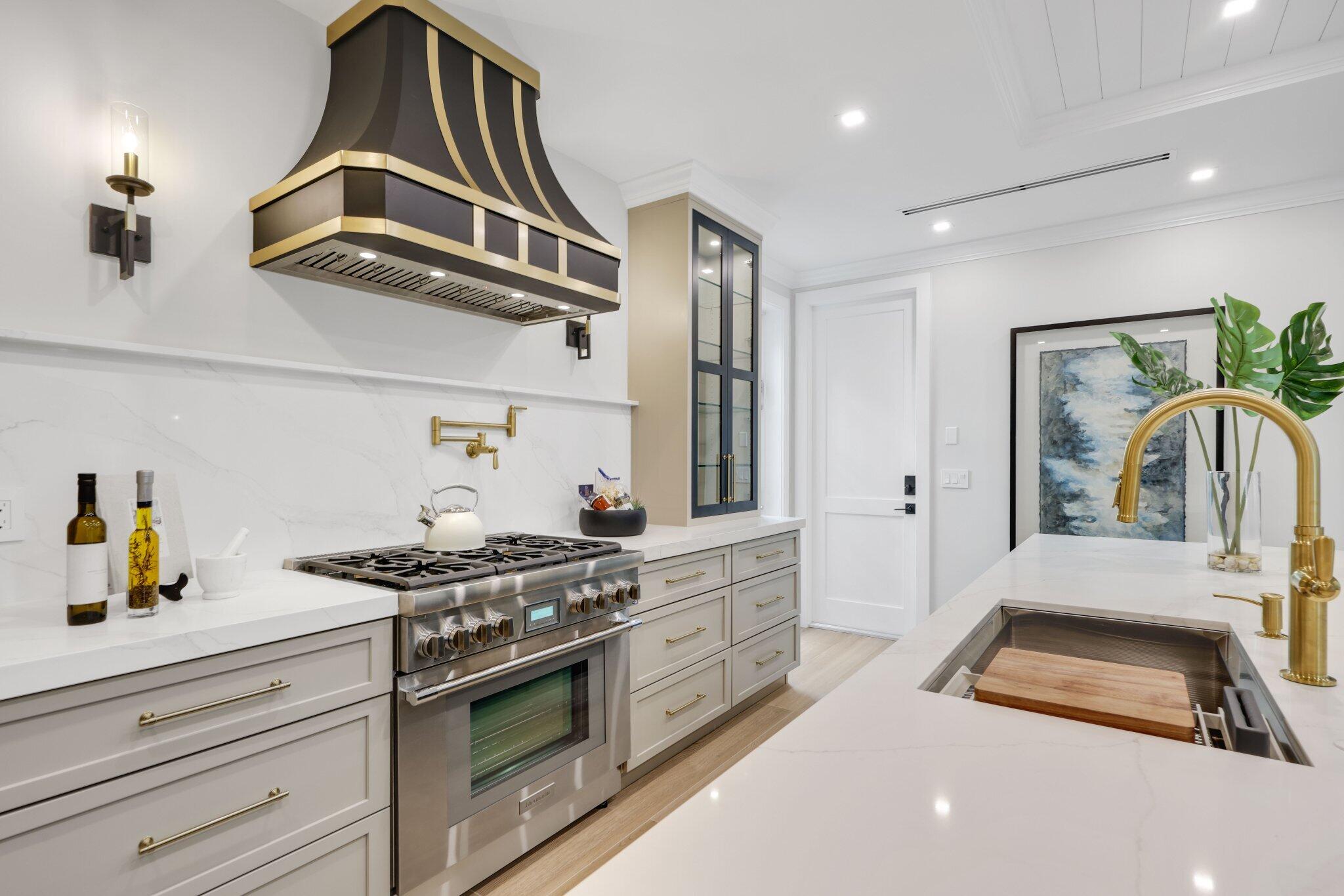 209 Northeast 5th Street Delray Beach, FL 33444 - Photo 15 of 47 a kitchen with stainless steel appliances granite countertop a stove and a sink