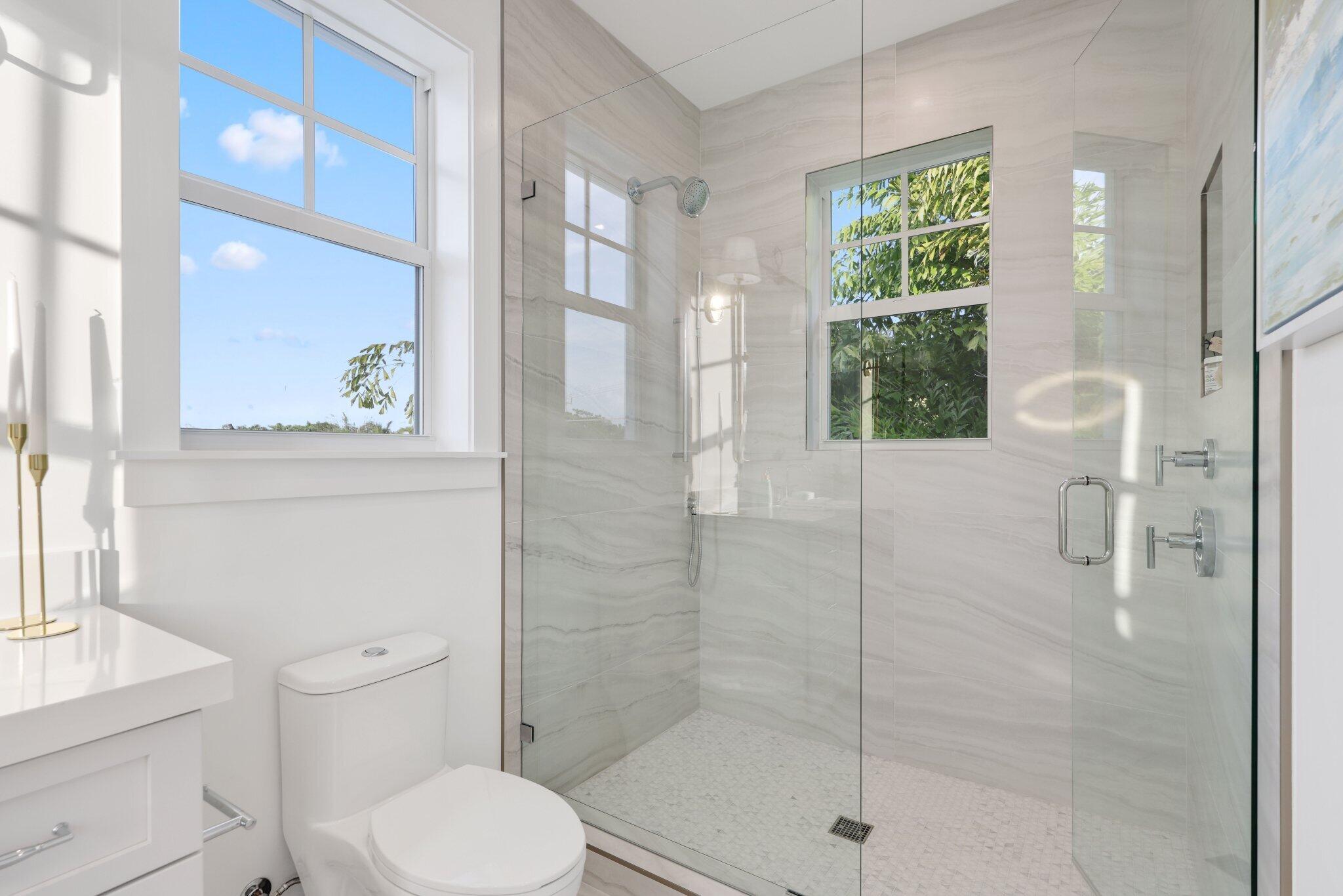 209 Northeast 5th Street Delray Beach, FL 33444 - Photo 19 of 47 a bathroom with a shower and toilet