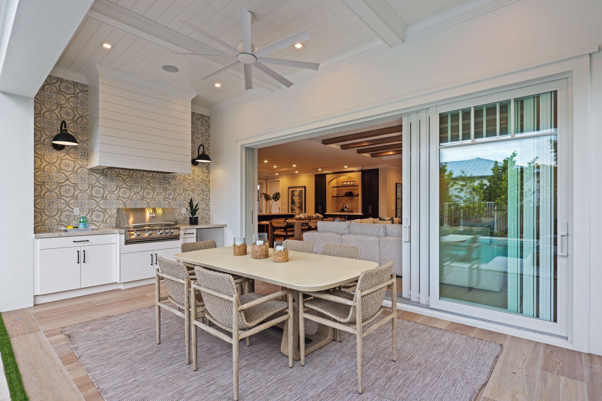 209 Northeast 5th Street Delray Beach, FL 33444 - Photo 37 of 47 a dining room with stainless steel appliances granite countertop furniture wooden floor and a rug
