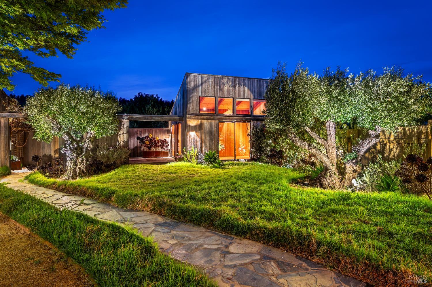 336 Pipers Reach The Sea Ranch, CA 95497 - Photo 14 of 15 Guest house and deck with sliding barn door for privacy framed by 2 100-year old olive trees. 2-car garage is barely seen in the left hand photo.