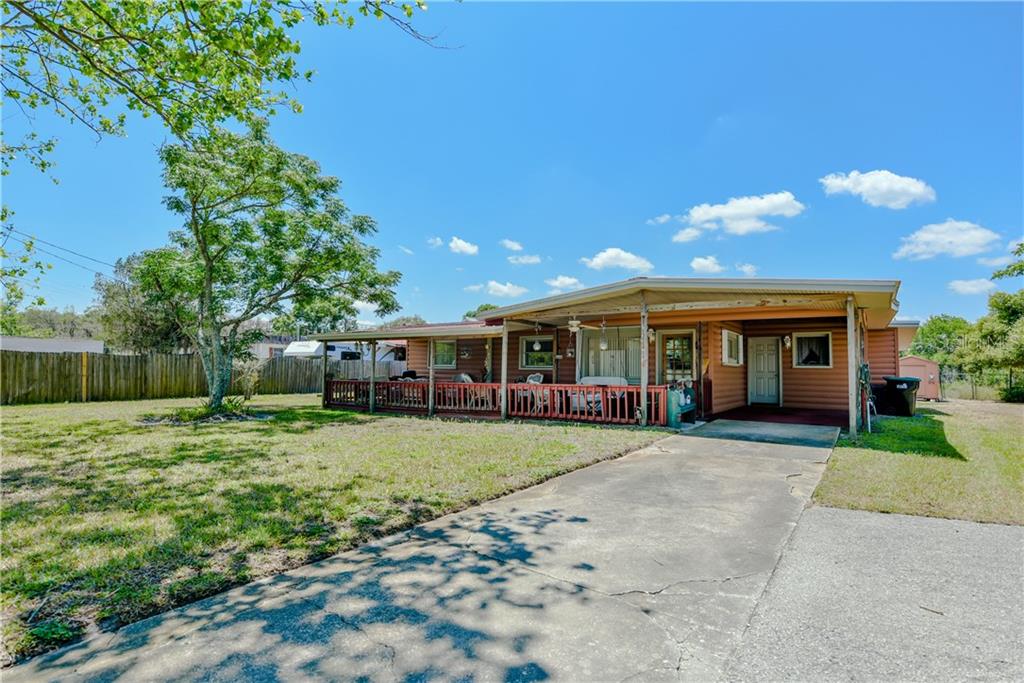 2910 Aein Road Orlando, FL 32817 - Photo 1 of 1 Large lot and front porch and a 1 car carport