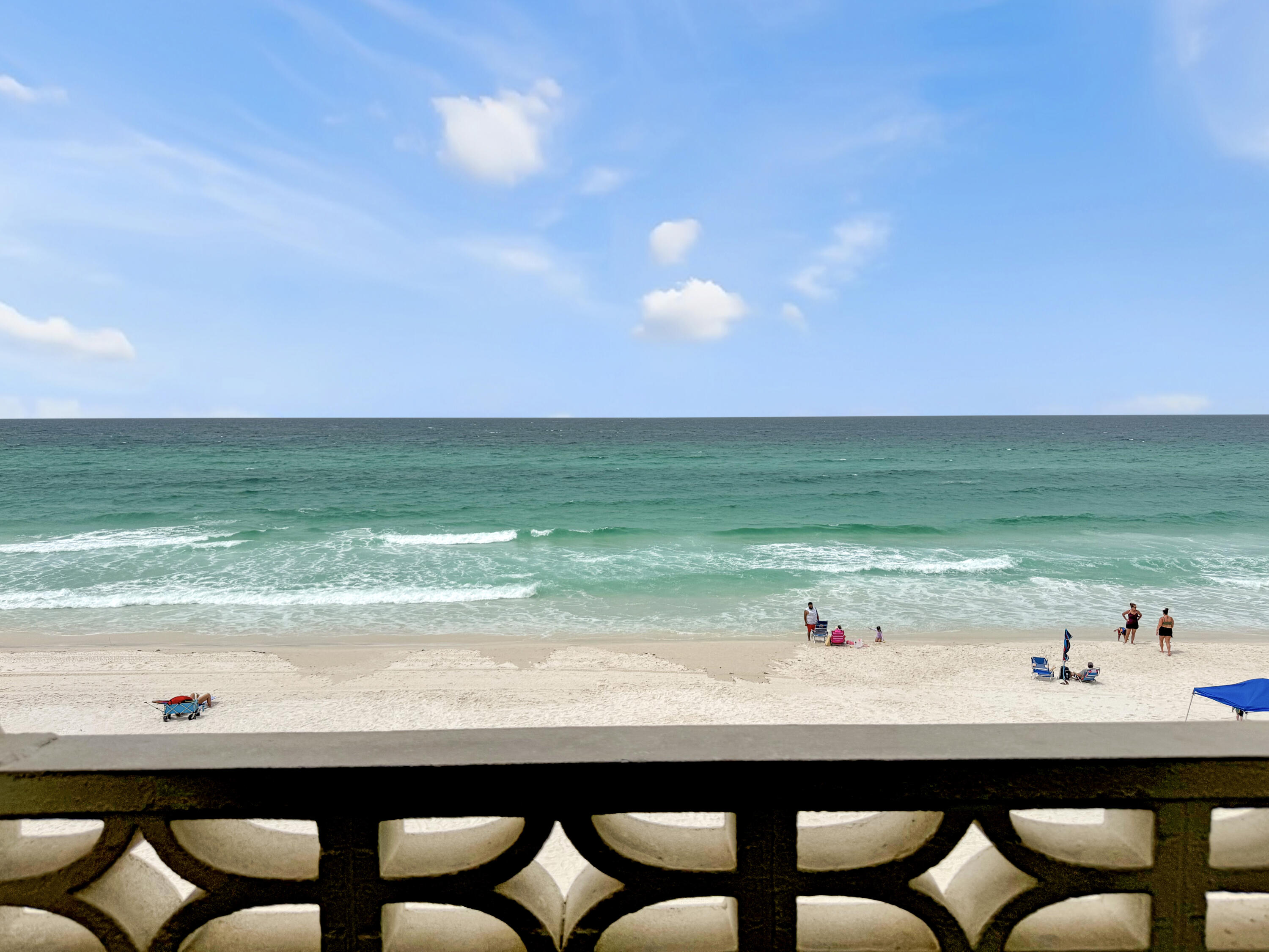 14401 Front Beach Road, Unit 221 Panama City Beach, FL 32413 - Photo 13 of 20 a view of a dining table and chairs in the patio