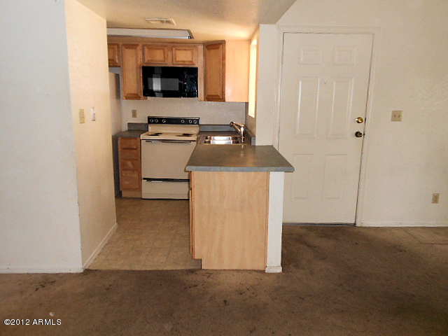 2855 South Ext Road, Unit 241 Mesa, AZ 85210 - Photo 15 of 20 kitchen and front door