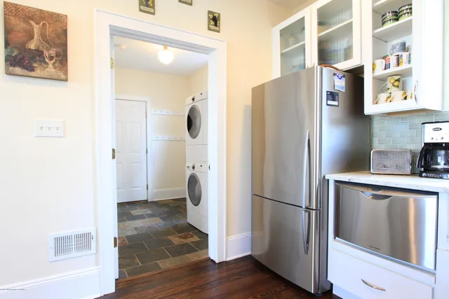 a kitchen with stainless steel appliances a refrigerator and a sink