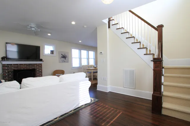 a view of living room with furniture and a flat screen tv