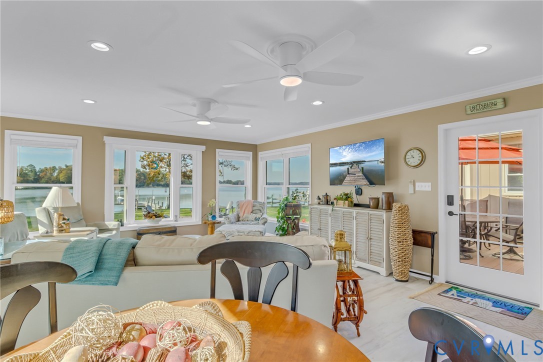 358 Barn Point Road Lottsburg, VA 22511 - Photo 11 of 48 a living room with furniture a large window and a table