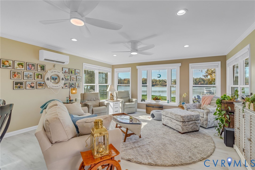 358 Barn Point Road Lottsburg, VA 22511 - Photo 12 of 48 a living room with furniture and a large window