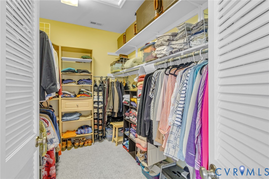 358 Barn Point Road Lottsburg, VA 22511 - Photo 18 of 48 a view of walk in closet with clothes
