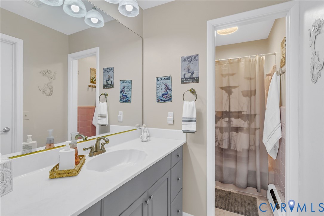 358 Barn Point Road Lottsburg, VA 22511 - Photo 26 of 48 a bathroom with a sink double vanity and a mirror