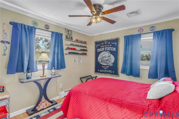 a bed room with a bed mirror and a window