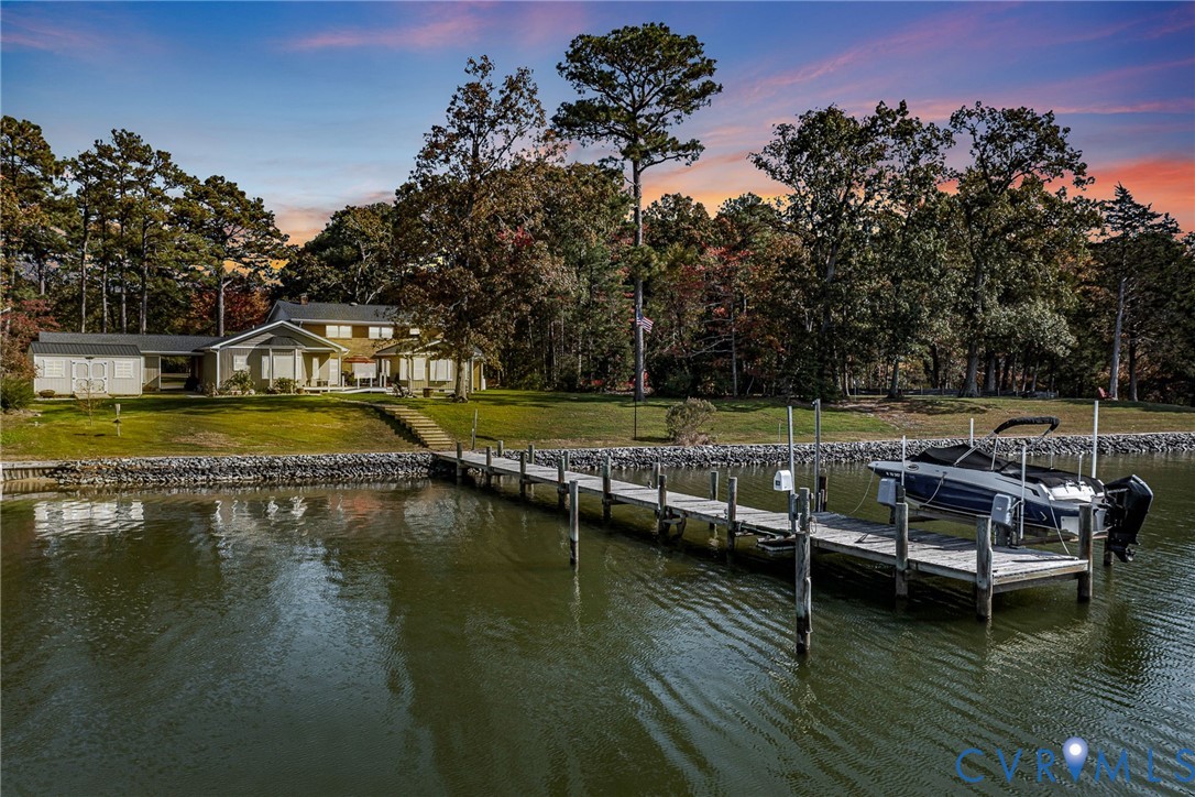 358 Barn Point Road Lottsburg, VA 22511 - Photo 3 of 48 a view of a lake with boats and trees in the background