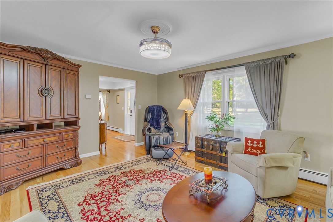 358 Barn Point Road Lottsburg, VA 22511 - Photo 4 of 48 a living room with furniture and a large window