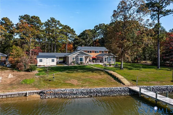 a swimming pool view with a lake view