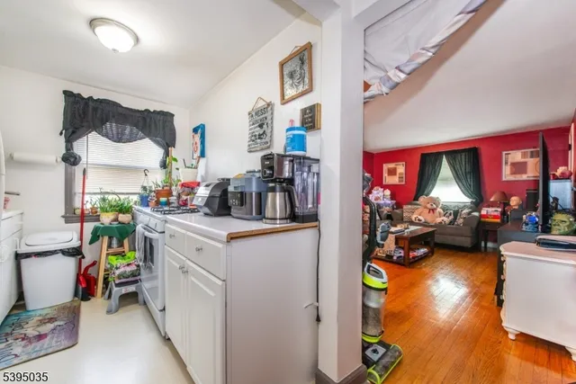 a very nice looking room with many windows and furniture