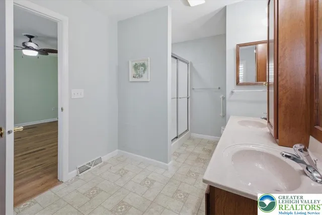 a view of walk in closet with clothes