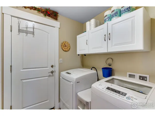 a utility room with sink dryer and washer