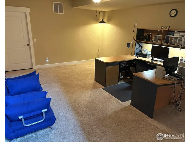 a workspace with furniture and window